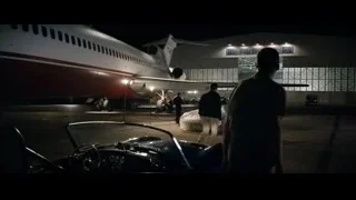man in vintage car at night airport — Ford v Ferrari