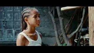 Young girl with braided hair near brick wall — The Karate Kid