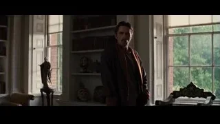 man standing in library room — Batman: The Dark Knight Rises