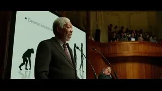 man giving speech on Darwinian Evolution — Lucy