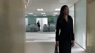 Woman walking in office corridor — Suits