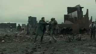 man with gun and shield in destroyed area — Blade Runner 2049
