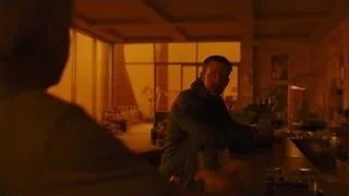Man deep in thought at dimly lit bar — Blade Runner 2049