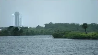 island with rocket launch tower — Elon Musk: Return to Space