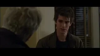 young man in dimly lit room — The Amazing Spider Man