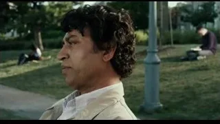 man with curly hair on park bench — Life of Pi
