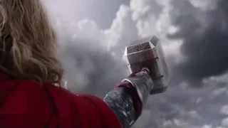 person holding glowing spaceship against cloudy sky — The Avengers