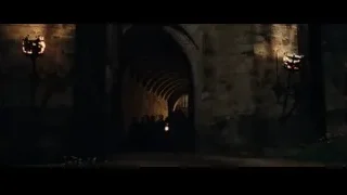 people walking through dark stone archway — Harry Potter and the Philosophers Stone