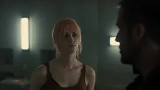 man comforting woman in dark room — Blade Runner 2049