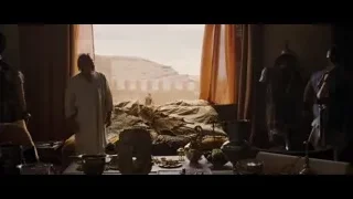 man in white robe by window desert view — Gladiator