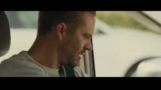 man sitting in car — Furious Seven