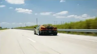 black sports car on highway — Sports Cars