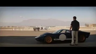 Man walking towards blue sports car — Ford v Ferrari