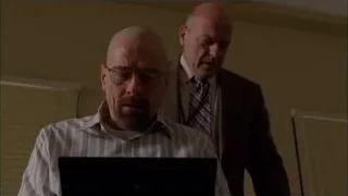 two men looking at laptop in office — Breaking Bad