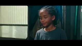 young girl standing in dimly lit room in thought — The Karate Kid