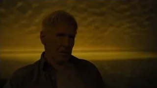 man sitting with serious expression — Blade Runner 2049