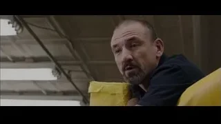 man with bald head and mustache looking serious — Creed