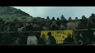 young man crouching in front of crowd — Harry Potter and the Goblet of Fire