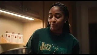 woman in kitchen wearing JAZZ sweatshirt — The Bear