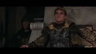young man in armor sitting on ornate throne — Gladiator