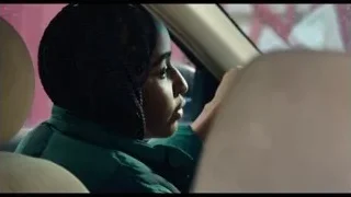 Young woman in car looking out window — The Bear