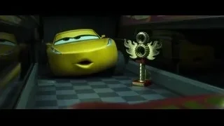 yellow car in garage with trophy — Cars 3