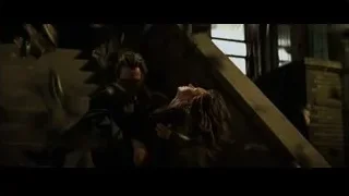 man and woman on stairs in dark room — Batman