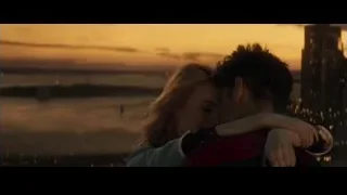 Spider-Man and blonde woman embracing at sunset — The Amazing Spider Man 2