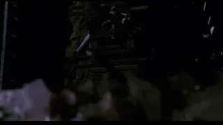 Person climbing wooden structure at night — Spider Man