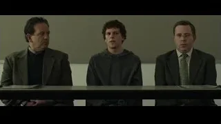 Three men sitting at courtroom table — The Social Network