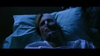 Person unconscious in hospital bed — Batman: The Dark Knight