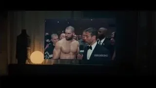 Man speaking on stage with HBO Boxing screen — Creed 2