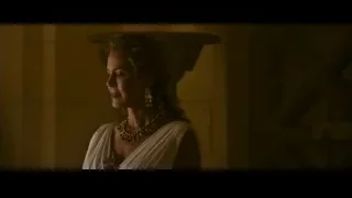 woman in white dress in dimly lit room — Gladiator 2