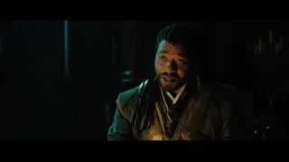 man with dreadlocks smiling in dim room — Doctor Strange 2