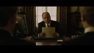man in suit at office desk — The Social Network