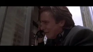 man talking on phone in telephone booth — American Psycho