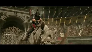 man riding rhinoceros in Roman arena — Gladiator 2