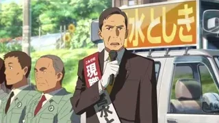 Man in suit speaking into microphone — Your Name
