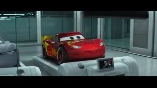 red car driving on track in futuristic room — Cars 3