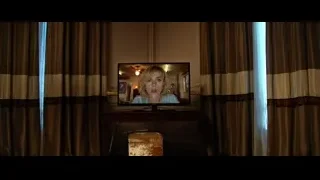 living room with TV showing woman's face — Lucy
