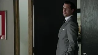 Man in suit standing in front of door — Suits