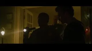 two men holding flashlight in dark room — The Social Network