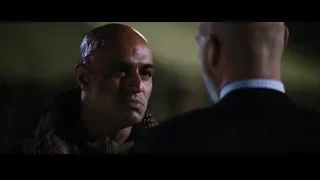 two bald men in tense conversation — Iron Man