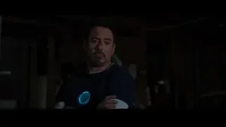 Man with beard in dimly lit room — Iron Man 3