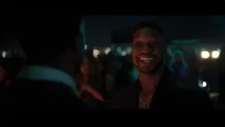 man speaking passionately in crowded nightclub — Creed 3