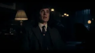 Man in suit standing at desk in dark room — Peaky Blinders