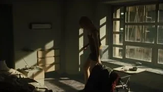 young woman crouching in abandoned room — Blade Runner 2049