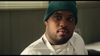 Man in green beanie and chef jacket — The Bear