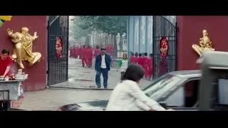 People walking past golden Buddha statues — The Karate Kid