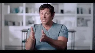 man sitting in living room gesturing — The Social Dilemma